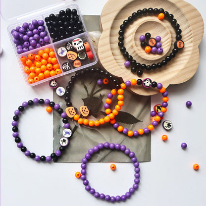 4-grid plastic storage box filled with Halloween resin beads and acrylic themed charms