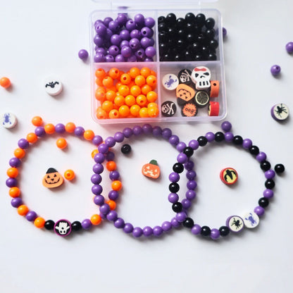 Finished handmade Halloween stackable bracelets made from resin bead kit on white background
