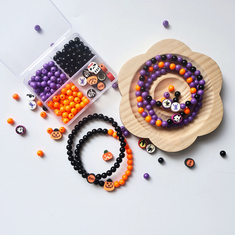 Handmade Halloween stackable bracelets with spooky charms, resin bead craft set for party