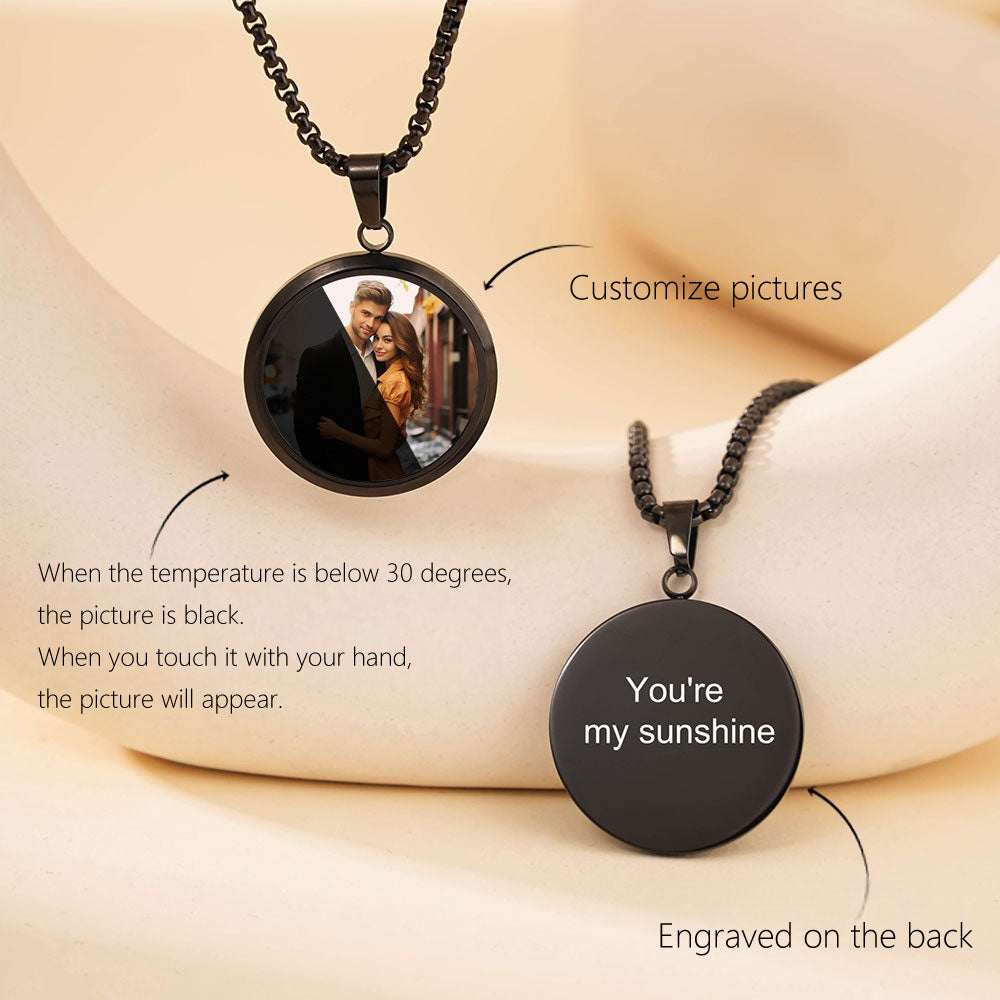Black round temperature sensitive necklace showing front custom photo and back engraved words