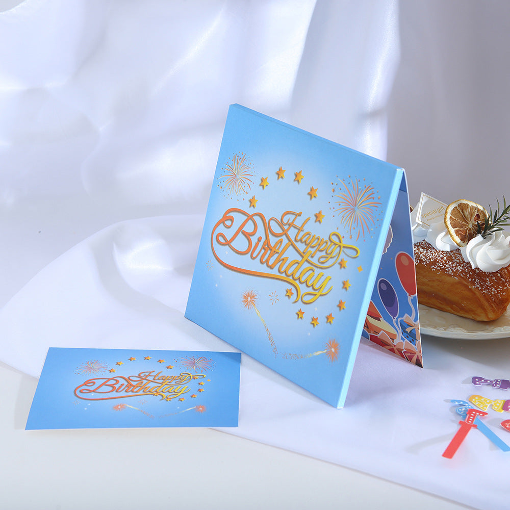 Blue fireworks birthday cake 3D pop up greeting card with LED lights lifestyle shot