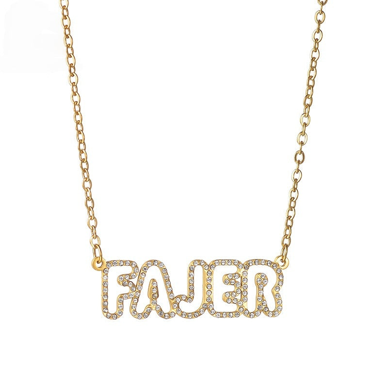 Studio shot of stainless steel custom bubble font zircon letter necklace on plain white background