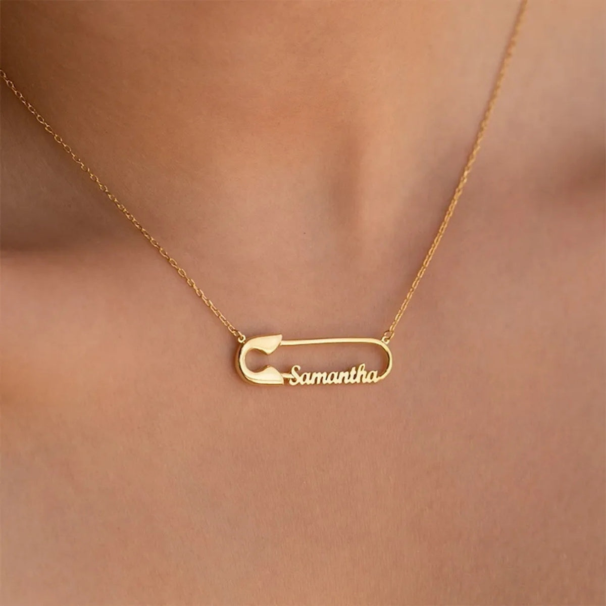 Close Up Wearing Minimalist Custom Safety Pin Name Necklace Personalized Cursive Name Gold Jewelry