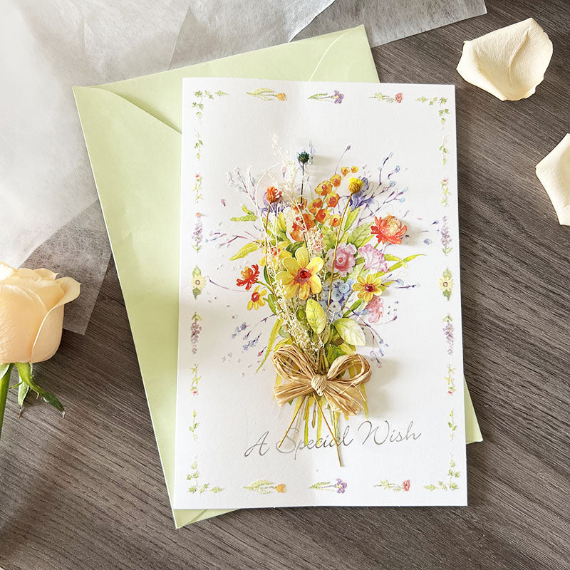Colorful wildflower dried greeting card with green envelope