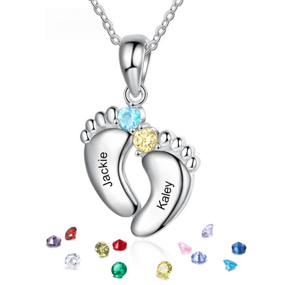 Silver brass double footprint pendant engraved with custom names, embedded with two-tone cubic zirconia and scattered birthstone particles
