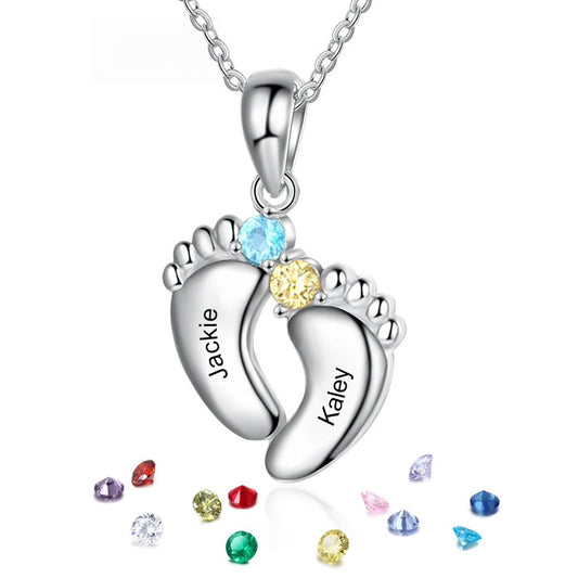 Silver brass double footprint pendant engraved with custom names, embedded with two-tone cubic zirconia and scattered birthstone particles