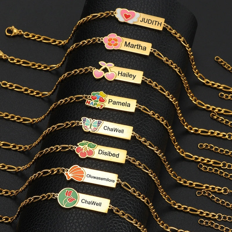 18K gold personalized engraved name bar bracelet collection with assorted fruit heart floral enamel charms, custom dainty wrist jewelry for women
