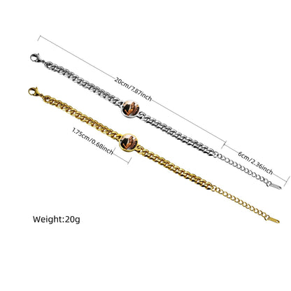 Gold and silver stainless steel heat reveal photo bracelets displayed together on black background