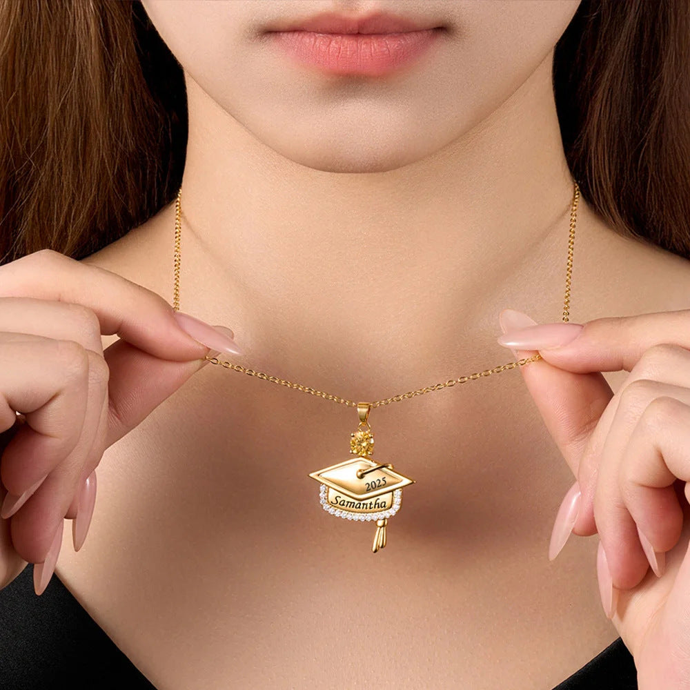 Hand display shooting of brass engraved zircon graduation pendant worn on female collarbone