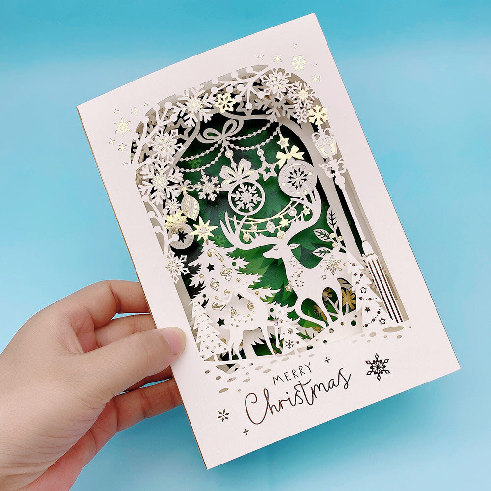 Green background layered paper cut Christmas reindeer pop up greeting card