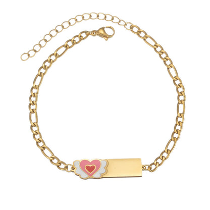 Minimal gold paperclip chain bracelet with custom engraved name bar and pink heart enamel charm, personalized daily wrist accessory