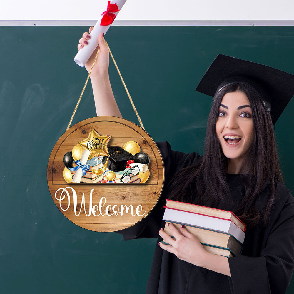 Girl holding interchangeable round welcome wooden sign for graduation party home decor