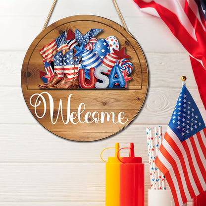 Interchangeable welcome wood sign with USA patriotic cutout beside American flag, 4th of July decor