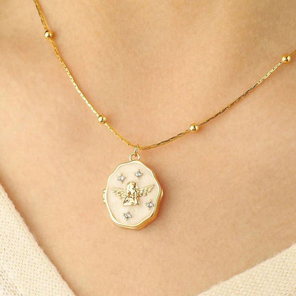 Simple wearing effect of gold brass angel enamel photo locket on female neck with plain background