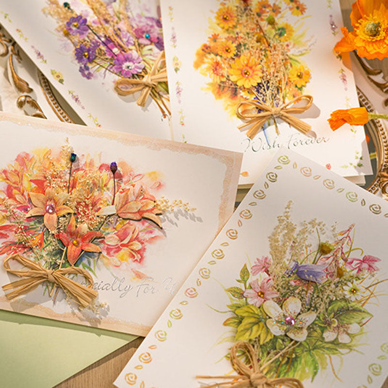 Assorted handmade dried flower greeting cards flat lay display