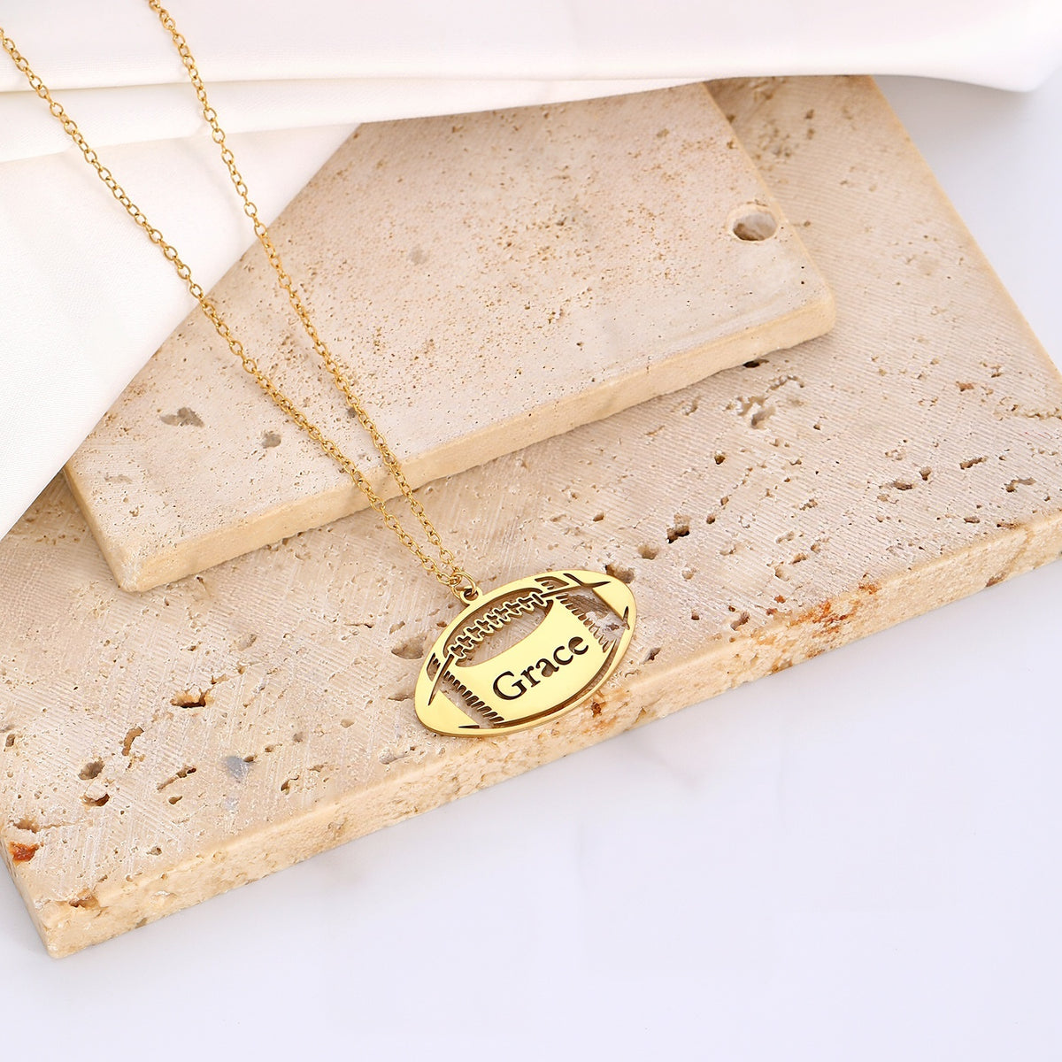 Personalized Engraved Football Name Necklace on Stone Background, Gameday Sports Jewelry