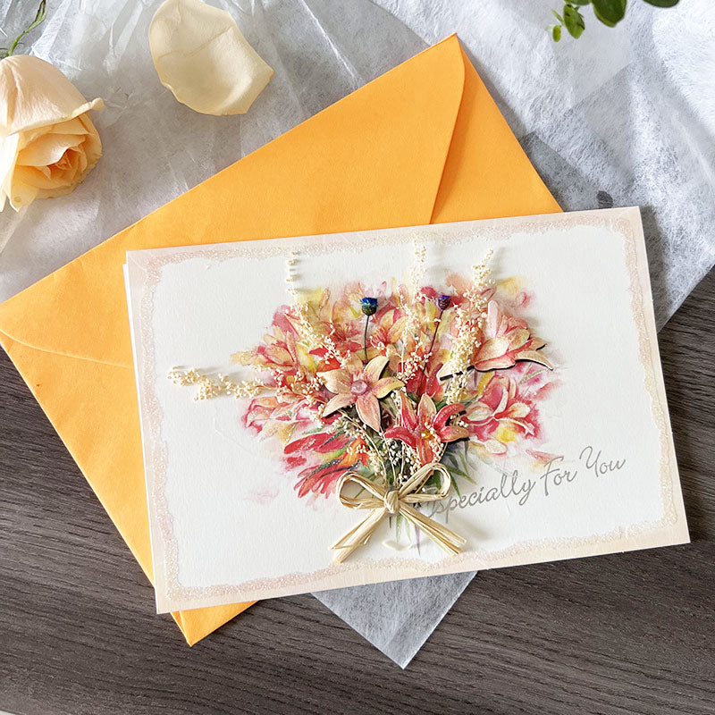 Pink dried flower bouquet greeting card with orange envelope