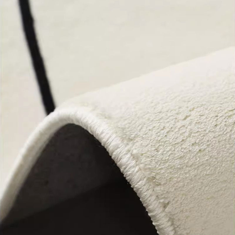 Close-up of dotted plastic non-slip backing for faux cashmere decorative floor rug