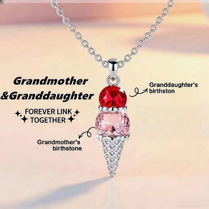 Silver tone brass ice cream pendant marked with corresponding birthstone positions for grandmother and granddaughter