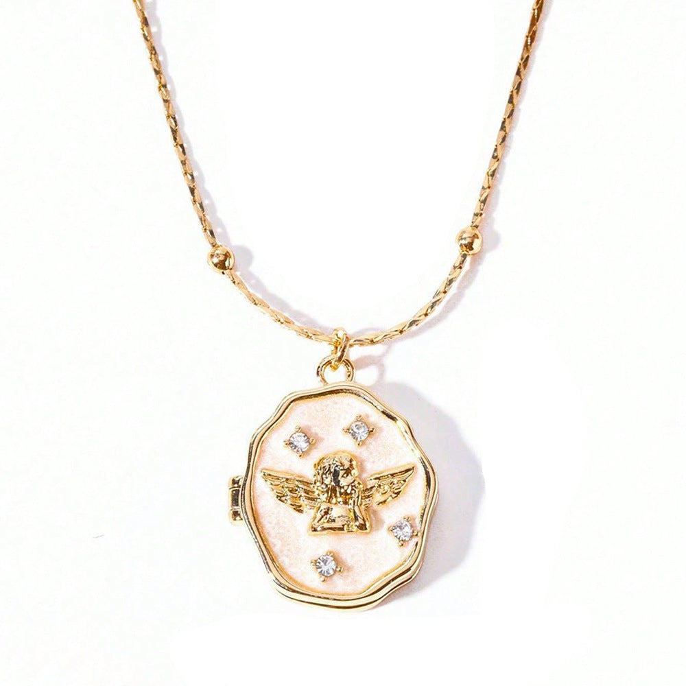Single irregular angel photo locket made of gold plated brass with enamel & crystal decoration on pure white background