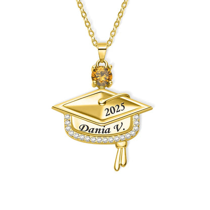 Clean white background product photo of engraved brass graduation cap necklace with paved cubic zirconia