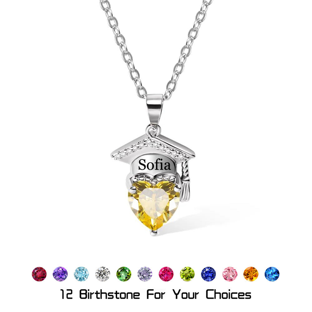 Pure silver brass engraved graduation pendant with yellow heart-shaped cubic zirconia on white background