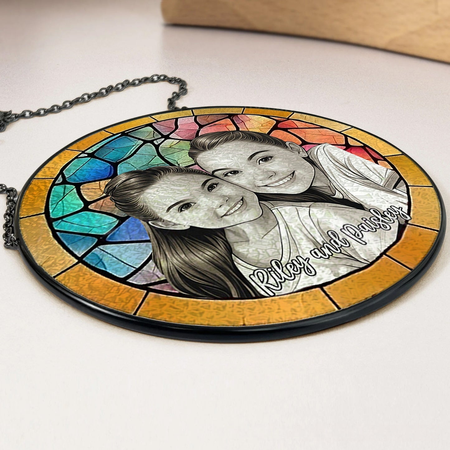 Side close up of custom stained glass photo suncatcher, transparent acrylic window hanging decor with metal chain