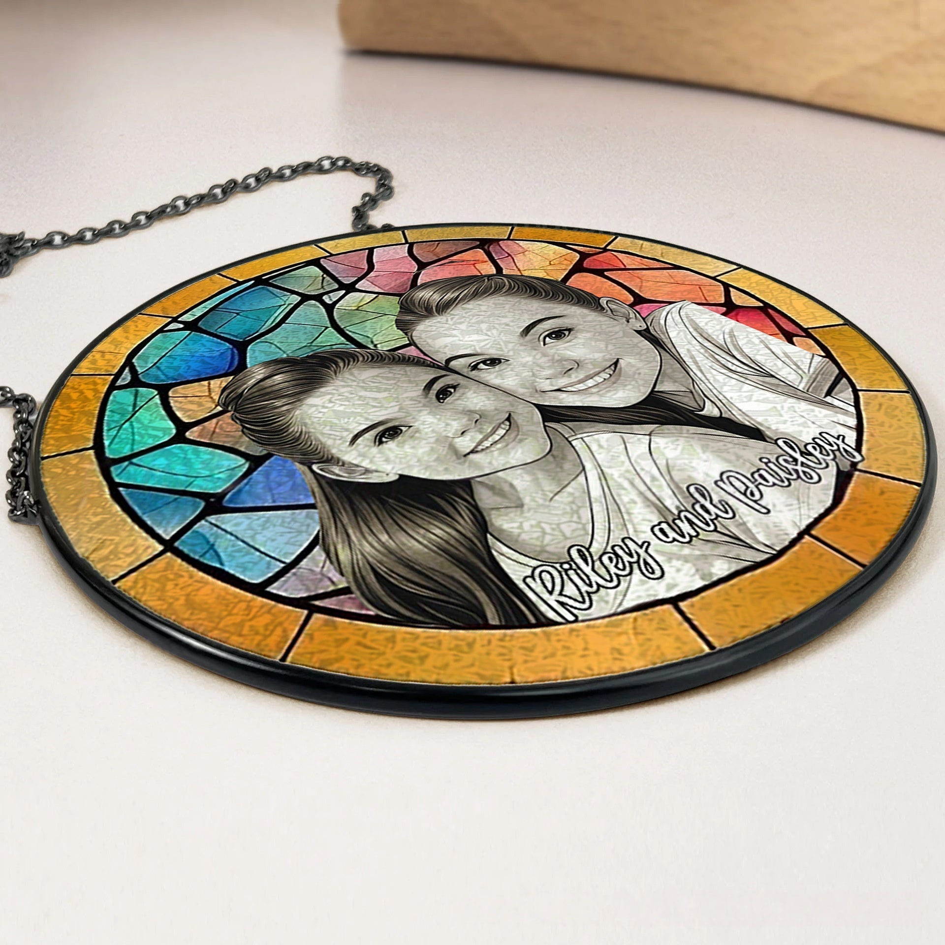 Side close up of custom stained glass photo suncatcher, transparent acrylic window hanging decor with metal chain