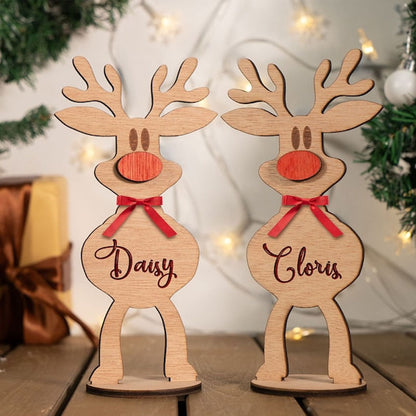 Two personalized wooden reindeer figurines
